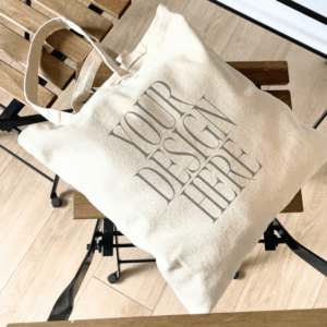 Tote Bag Mockup – Laid on Wooden Chair – Warm Rustic Setting